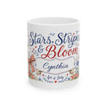Stars Stripes and Bloom mug front view — cottagecore patriotic design with wildflowers and red gingham bows