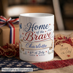 Home of the Brave ceramic mug — blue butterfly and floral border with 4th of July text