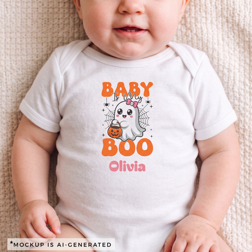 Baby is My Boo Halloween onesie flat lay - orange and pink kawaii ghost design with custom name in pink script