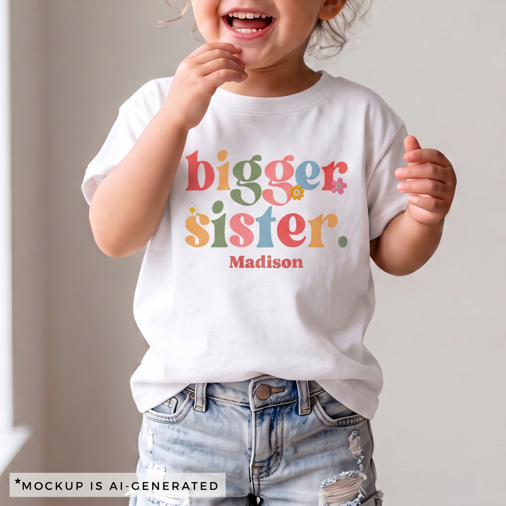 Bigger Sister colorful shirt flat lay in white - mixed color typography with daisy accents and personalized name below