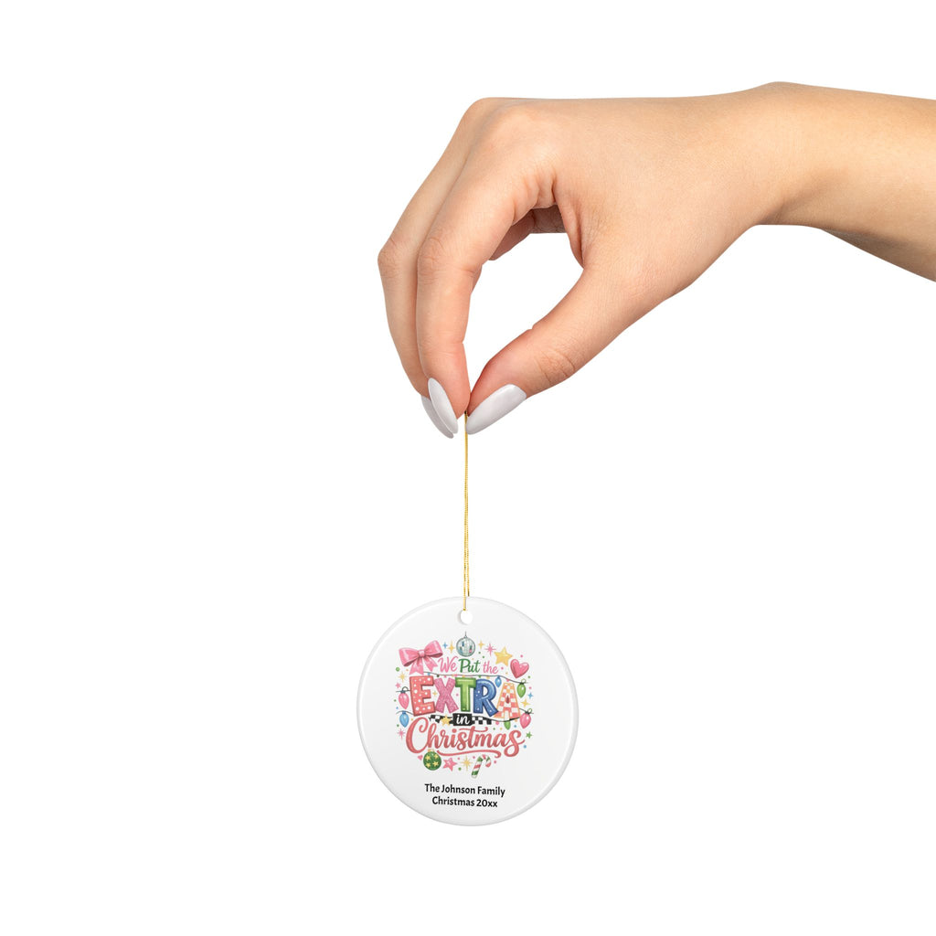 Back view of the ceramic Extra in Christmas family ornament with gold hanging string