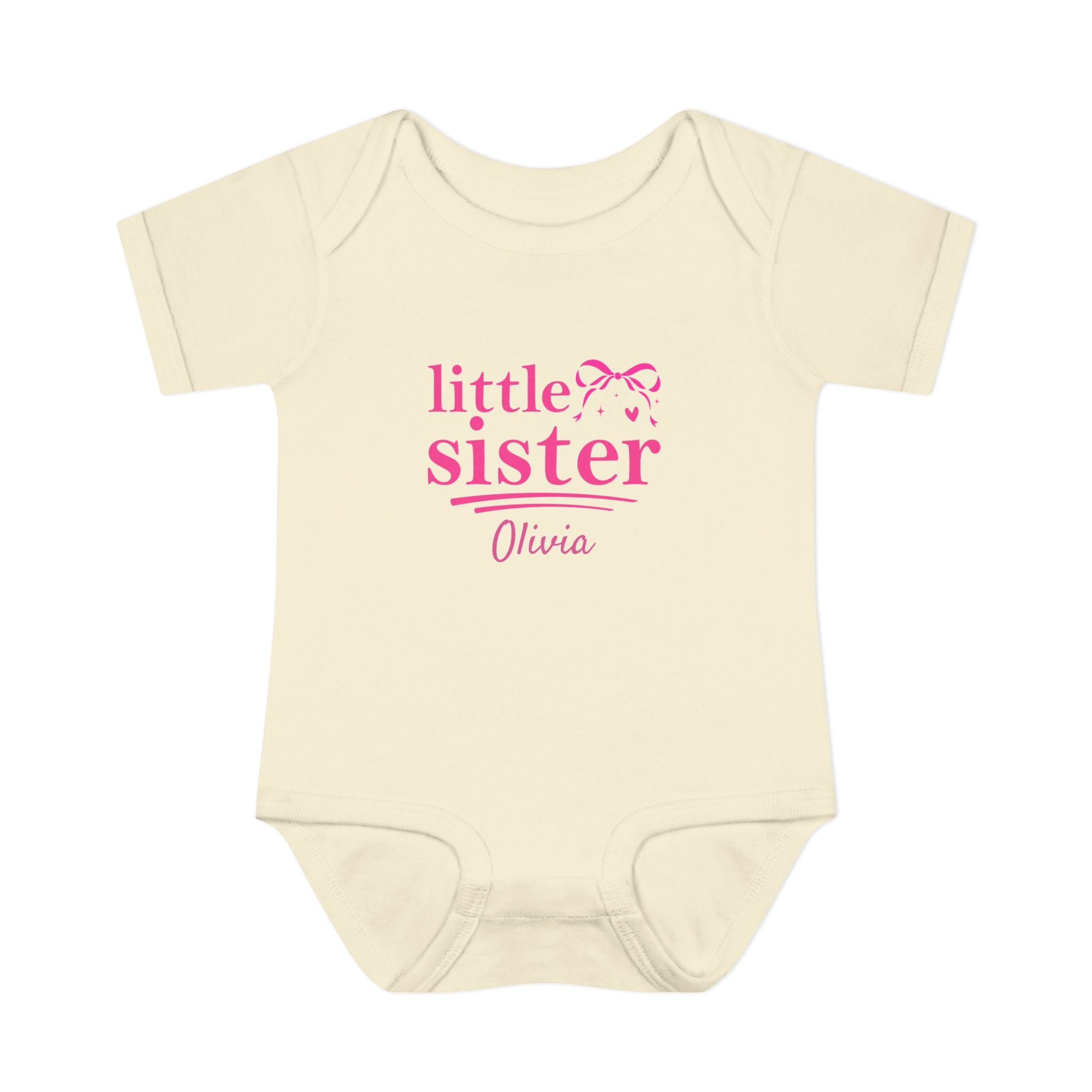 Close-up of Little Sister coquette onesie design - hot pink bow sparkles heart and personalized name in script font