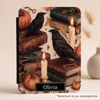 Close-up of autumn raven Kindle case design - black ravens on antique books with flickering candles orange pumpkins and vintage keys