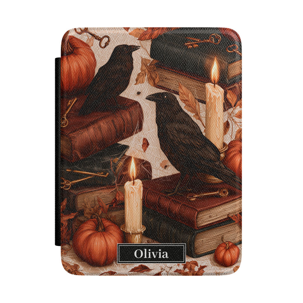 Personalized autumn raven Kindle case - gothic fall design with black ravens antique books candles pumpkins autumn leaves and custom name in black nameplate