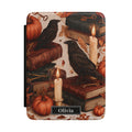 Personalized autumn raven Kindle case - gothic fall design with black ravens antique books candles pumpkins autumn leaves and custom name in black nameplate