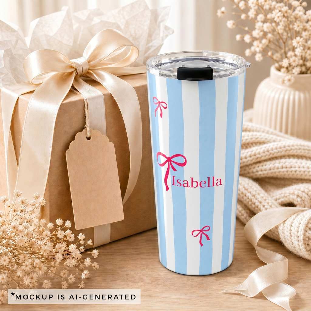 Close-up of blue stripe tumbler personalization - red bow with custom name in classic serif font