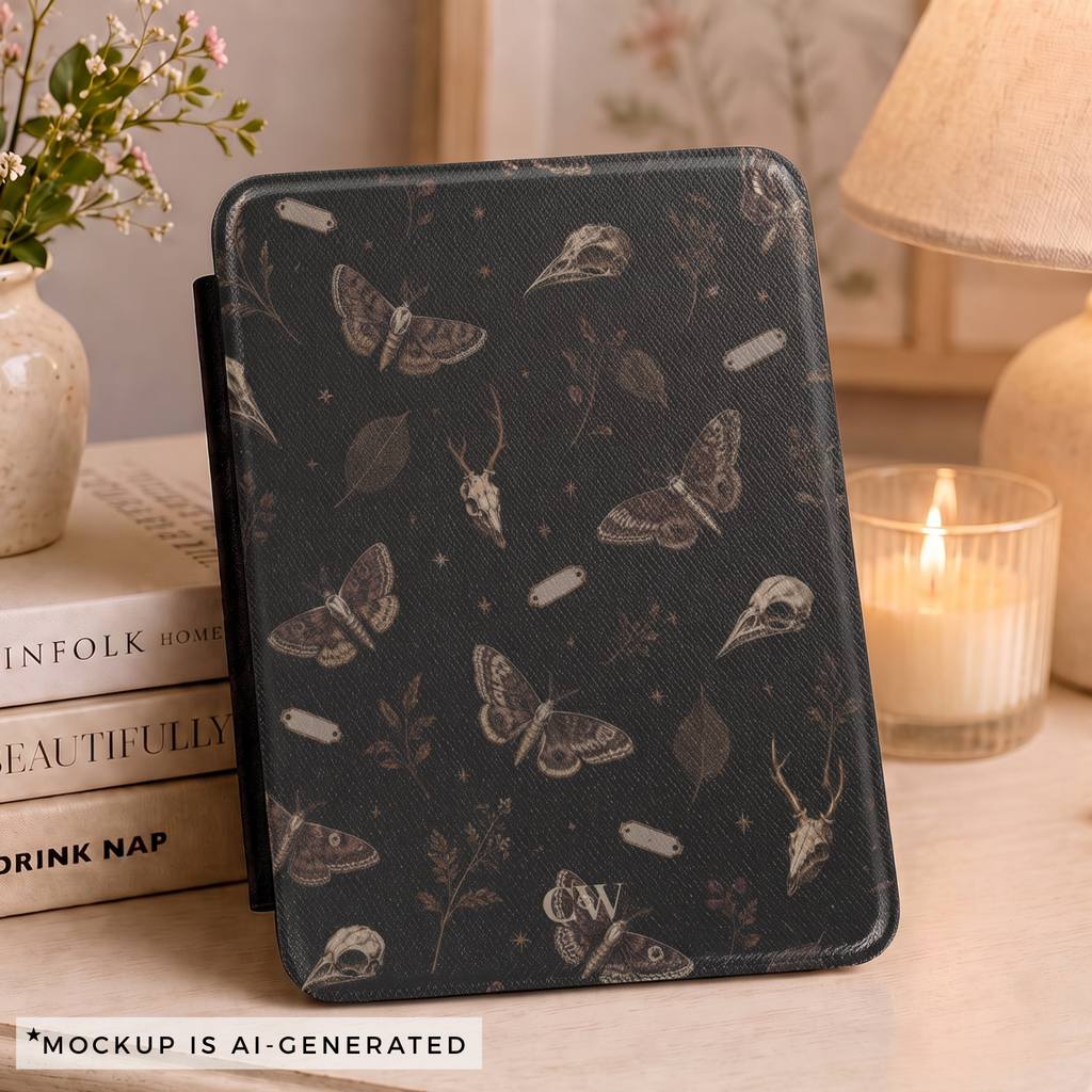 Close-up of gothic moth Kindle case pattern - detailed moths butterflies bird skulls botanical sprigs and stars on black