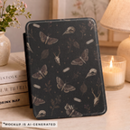 Close-up of gothic moth Kindle case pattern - detailed moths butterflies bird skulls botanical sprigs and stars on black