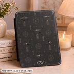 Witchy alchemy Kindle Paperwhite case flat lay - dark black background with moon phases keys potion bottles and personalized initials