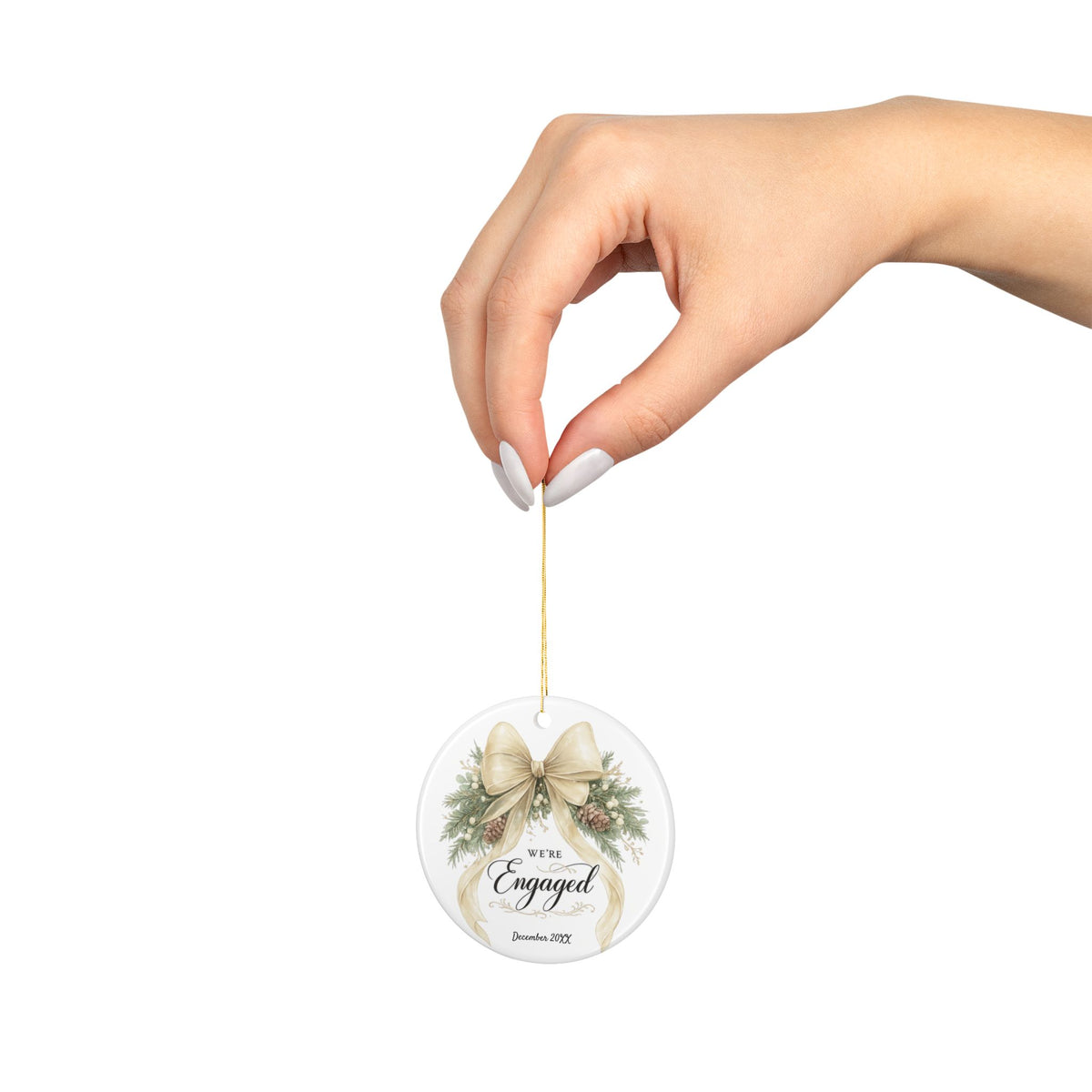 Back view of the ceramic We're Engaged ornament with gold hanging string